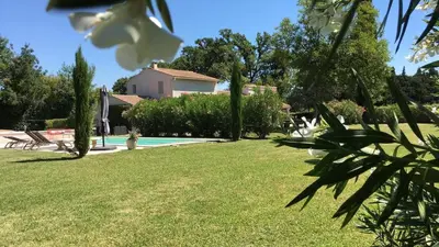 a view of a yard with a swimming pool at Les Carrairades in Mollégès