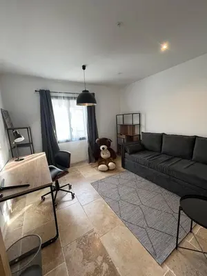a living room with a couch and a teddy bear at House with a view of Luberon and a pool in Maubec