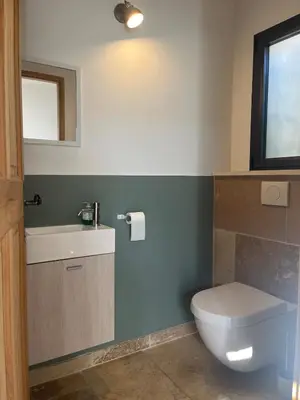 a bathroom with a toilet and a sink at House with a view of Luberon and a pool in Maubec
