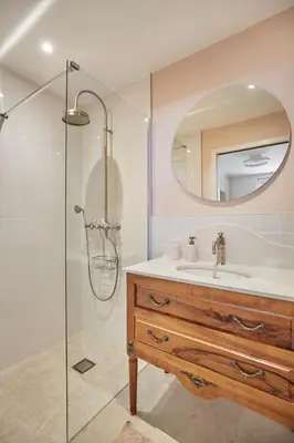 a bathroom with a sink and a shower with a mirror at Appartment 5 min walking from city center in Aix-en-Provence