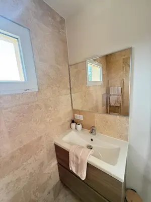 a bathroom with a sink and a mirror at Cozy studio with air conditioning & pool & parking in Aix-en-Provence