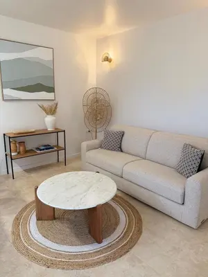 a living room with a couch and a coffee table at Escapade Provençale 5 in Aix-en-Provence