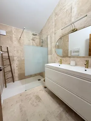 a bathroom with a sink and a mirror at Appartement Confortable en Provence in Aix-en-Provence