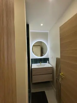 a bathroom with a sink and a mirror at Studio cosy proche d Aix en Provence climatisé in Éguilles
