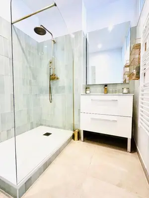 a bathroom with a shower and a sink and a tub at Design and Provençal Elegance Suite in Aix in Aix-en-Provence