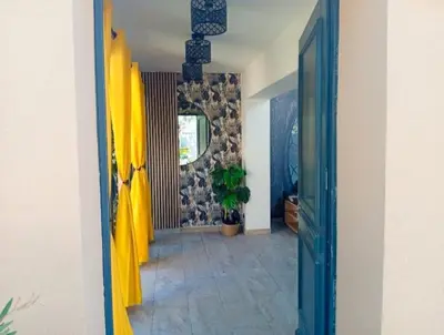 a hallway of a house with a yellow door at Casa Lova Spa Privé, Clim,Baignoire balnéo in Entraigues-sur-la-Sorgue