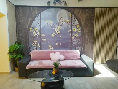 a living room with a pink couch and a table at Casa Lova Spa Privé, Clim,Baignoire balnéo in Entraigues-sur-la-Sorgue