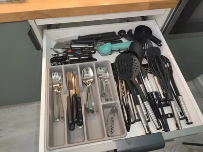 a drawer full of kitchen utensils in a drawer at Escapade dans le Luberon in Cavaillon
