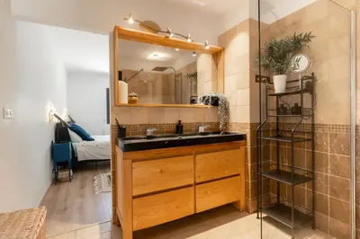 a bathroom with a sink and a mirror at Mas Provençal chic et élégant - Alpilles et Luberon in Sénas