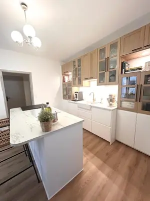 a kitchen with white cabinets and a white counter top at Villa de Seytres in Caumont-sur-Durance