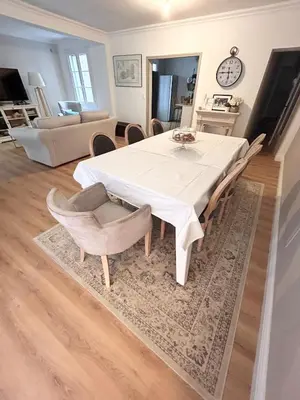 a dining room with a white table and chairs at Villa de Seytres in Caumont-sur-Durance