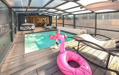 a house with a pool and a pink flamingo at Villa Avec Piscine Privée in Carpentras