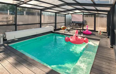 a swimming pool with a inflatable toy in the water at Villa Avec Piscine Privée in Carpentras