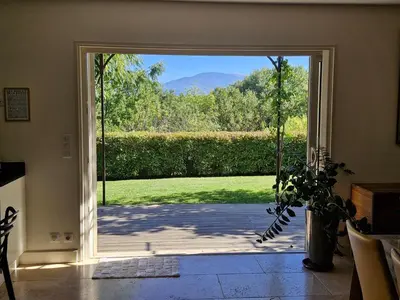 an open door to a patio with a view at La Canopée en Provence - Piscine, Vue sur le Mont Ventoux ! in Carpentras