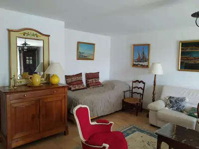 a bedroom with a bed and a mirror and a chair at Vaste villa , piscine , garage pour vélos et motos , grand parking in Caromb