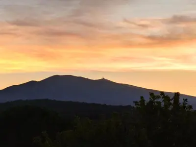 a view of a mountain at sunset at Vaste villa , piscine , garage pour vélos et motos , grand parking in Caromb