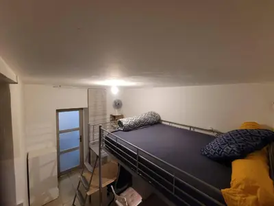 a bedroom with a bed in a room at Quiet ground floor, air conditioning, garden, 3 bedrooms, 7 people max in Salon-de-Provence