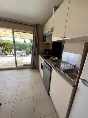a kitchen with a sink and a stove top oven at Petite maison à 2 pas du centre de Bédoin in Bédoin