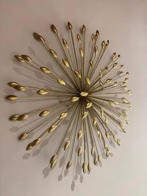a gold chandelier hanging from a ceiling at Appartement charmant d'Aix-en-Provence in Aix-en-Provence