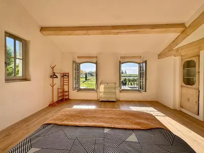 a large room with a large rug on the floor at Mas d Anissa in Avignon