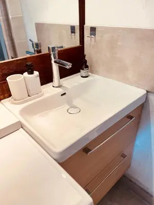 a white sink in a bathroom with a mirror at Duplex Cosy Aix proche CV terrasse clim parking in Aix-en-Provence