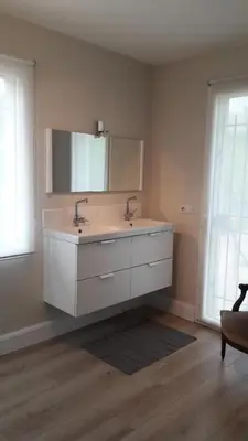 a bathroom with a sink and a mirror at Fully renovated Provençal farmhouse in Châteauneuf-de-Gadagne