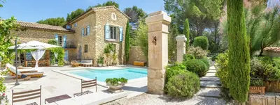 a house with a swimming pool in a yard at Charming House At The Foot Of Luberon In Maubec in Maubec