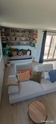 a living room with a couch with pillows at Chic & Cozy 95m Apartment Perfect for Families in Aix-en-Provence