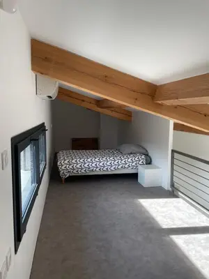 a small room with a bed and a window at Tiny house avec terrasse privée - Parking - Fibre TV in Lambesc