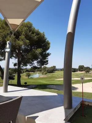 a living room with a couch and a refrigerator at Appartement golf saumane Celomidie in Saumane-de-Vaucluse
