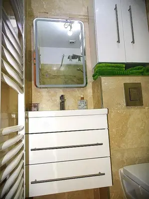 a bathroom with a sink and a mirror at AQUA TERRA-Studio Cozy-Aix Historic Center- SMART TV-WIFI in Aix-en-Provence