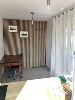 a table and chairs in a room with a couch at Appartement en Luberon in Pertuis
