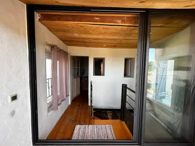 a view of a room with a glass door at Maison robion in Robion en Luberon