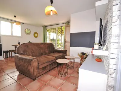 a living room with a couch and a table at Apartment Les Santons by Interhome in Peypin-dʼAigues