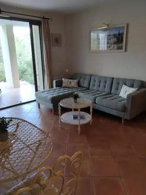 a living room with a couch and a table at Golf de saumane in Saumane-de-Vaucluse