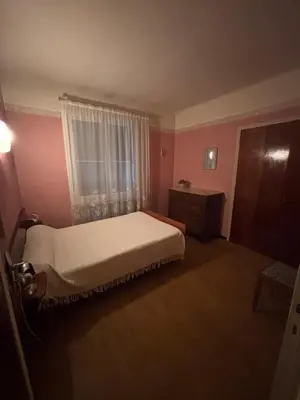 a small bedroom with a bed and a window at Maison Provençale au centre du village in Mollégès