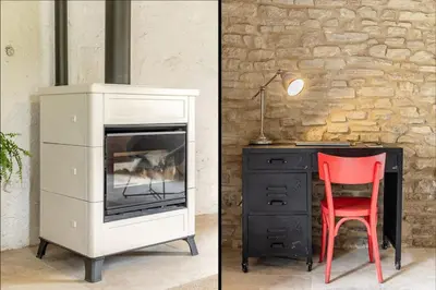 a desk and a chair next to a desk with a fireplace at La Bergerie des Sorgues in LʼIsle-sur-la-Sorgue