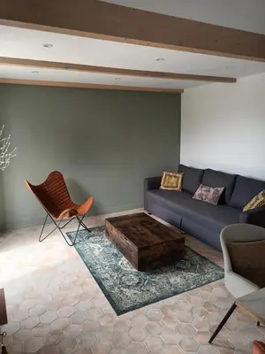 a living room with a couch and a coffee table at petite Villa in Manosque
