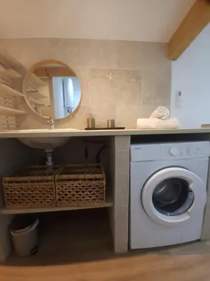 a bathroom with a washing machine and a mirror at Duplex Design - Clim - Parking privé - Wifi - by CommeChezSoi in Vedène