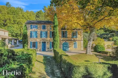 an image of a house with a tree at Château Constantin in Cadenet