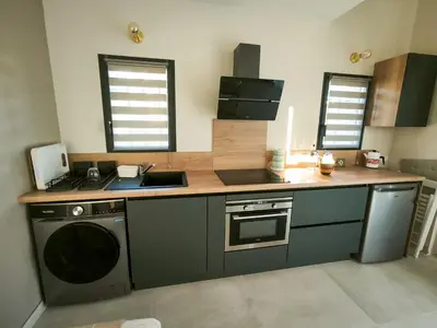 a kitchen with a sink and a stove at Le Mazet de Christol in Eygalières