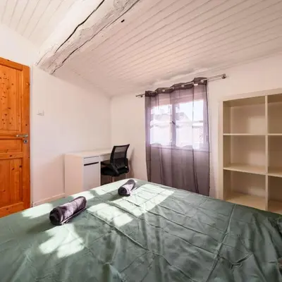 a bedroom with a bed and a desk and a chair at Les Toits d'Aix - Hyper center - Cours Mirabeau - Lumineux in Aix-en-Provence