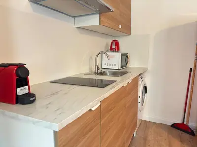 a kitchen with a sink and a microwave at Chez Fleur in Aix-en-Provence
