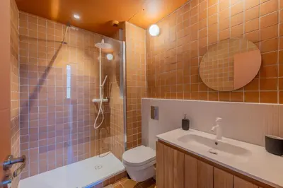 a bathroom with a shower and a toilet and a sink at Appartement Belle Lettre 8 in Aix-en-Provence