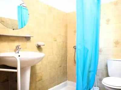 a bathroom with a sink and a mirror and a toilet at Holiday Home in Provence near Mont Ventoux in Bédoin