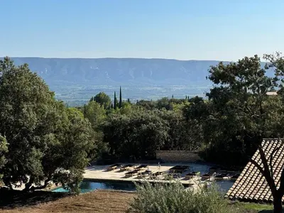 a group of birds sitting in a river with trees at Stunning Stone House With Pool Near Gordes in Gordes