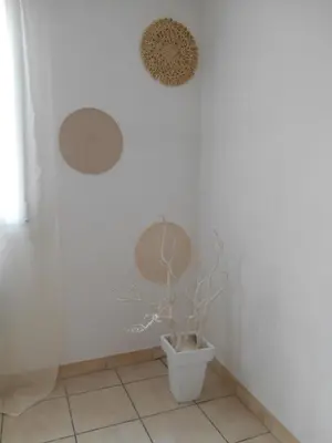 a bathroom with a toilet with a plant in it at Maison lumineuse proche du centre in Carpentras