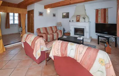a living room with two couches and a fireplace at Pet Friendly Home In Gargas With Wifi in Gargas