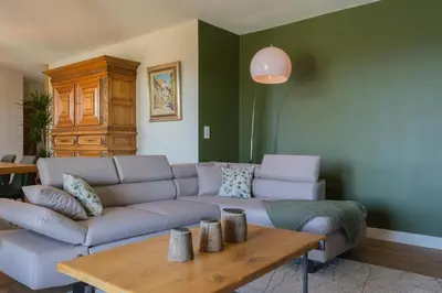 a living room with a couch and a table at La Maison De Paulette in Joucas