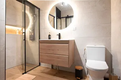 a bathroom with a toilet and a sink and a mirror at Studio Cosy au Cœur de la Ville in Salon-de-Provence
